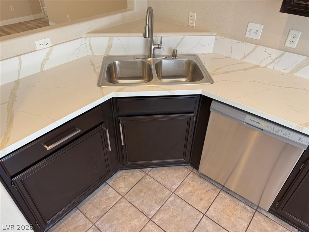 3962 Coyote Ridge Court Las Vegas, NV 89129 - Photo 6 of 35 A well-appointed kitchen corner features a dual basin sink and modern stainless steel dishwasher.