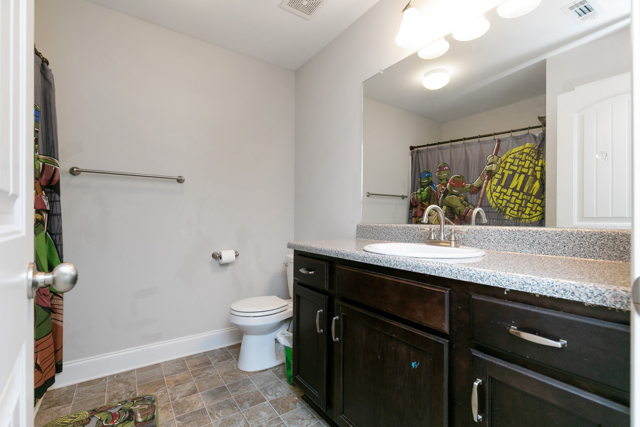 2348 Pea Ridge Road Clarksville, TN 37040 - Photo 22 of 29 a bathroom with a granite countertop sink a toilet and a mirror