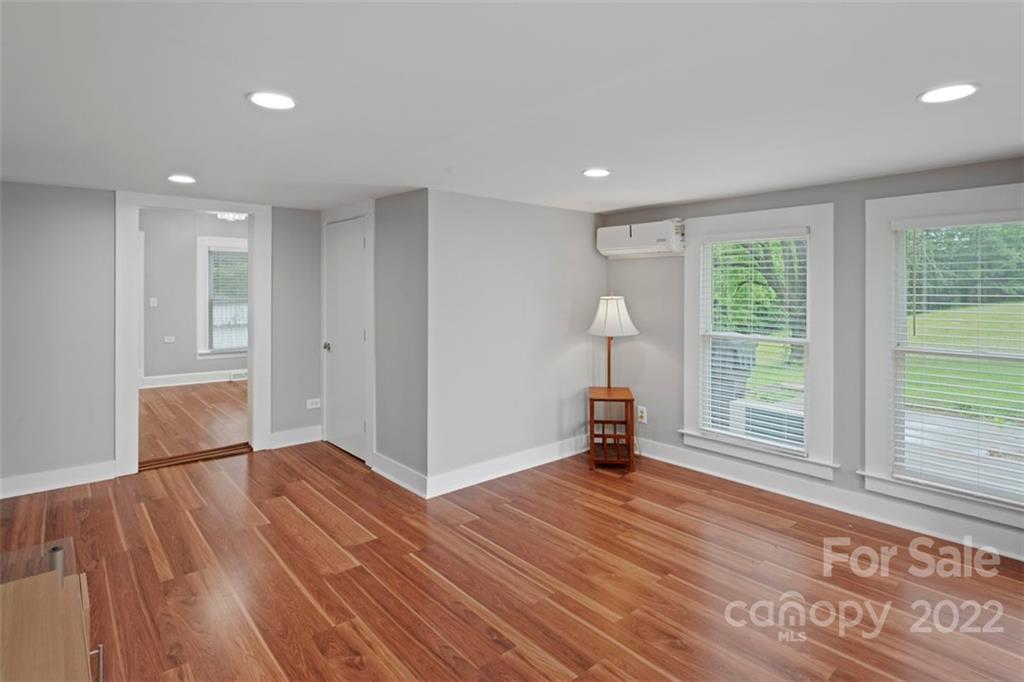 2139 Quaker Road Siloam, NC 27047 - Photo 18 of 35 a view of empty room with wooden floor and fan