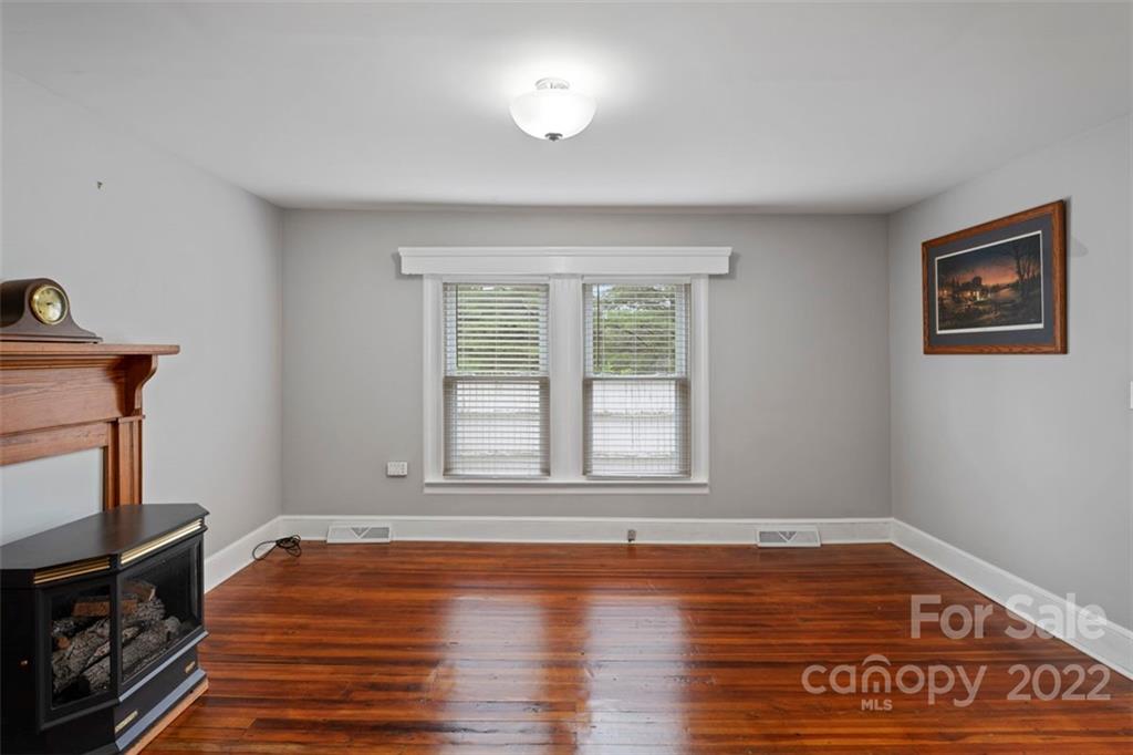 2139 Quaker Road Siloam, NC 27047 - Photo 23 of 35 a view of a room with window and wooden floor