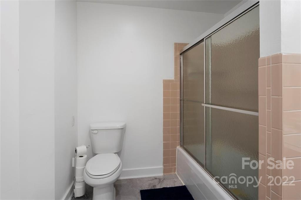2139 Quaker Road Siloam, NC 27047 - Photo 25 of 35 a bathroom with a shower and a toilet