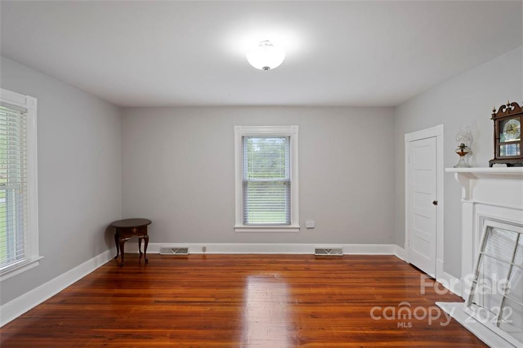 2139 Quaker Road Siloam, NC 27047 - Photo 32 of 35 a view of a livingroom with wooden floor and a window