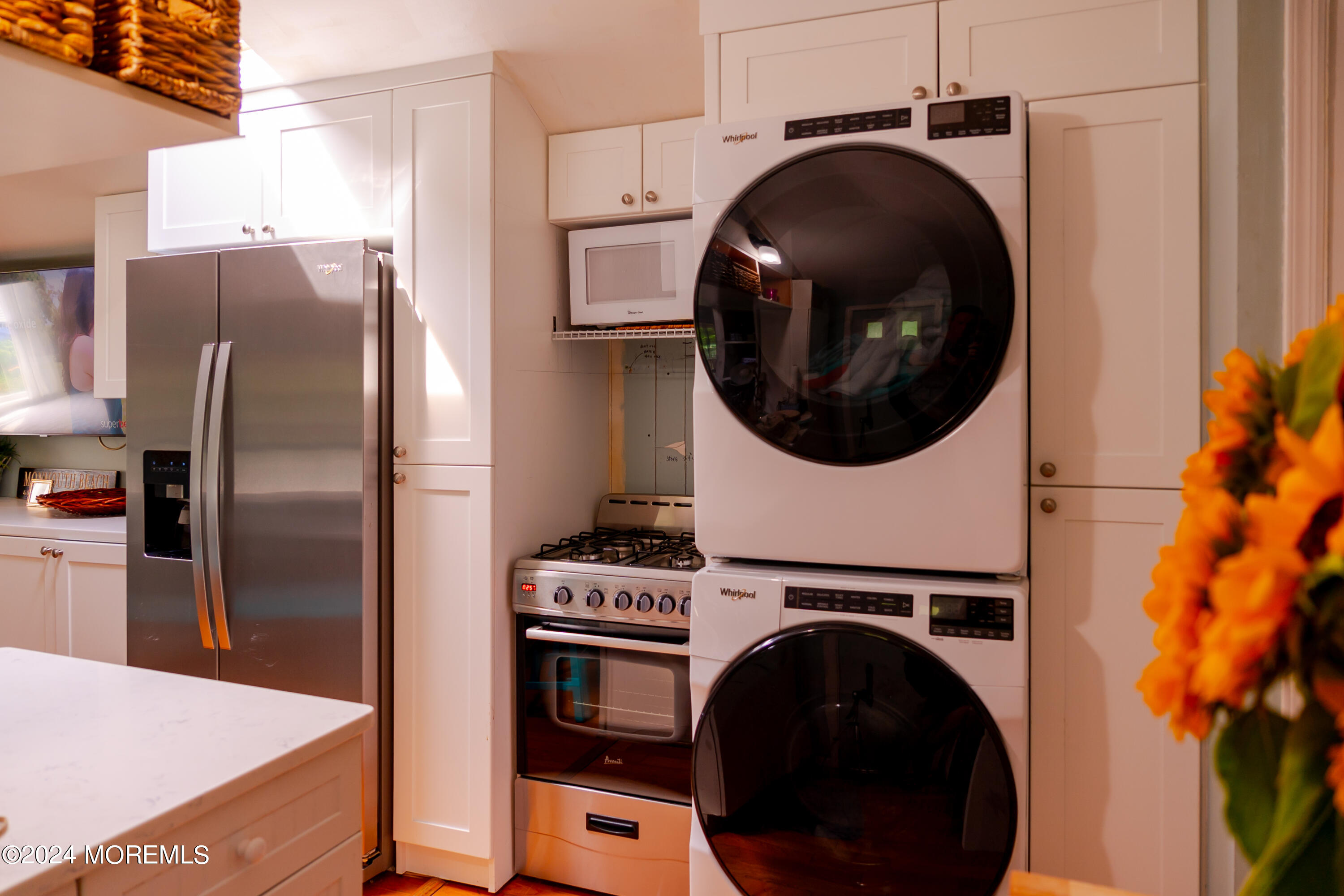 18 Valentine Street, Unit REAR Monmouth Beach, NJ 07750 - Photo 11 of 13 a kitchen with a washer and dryer
