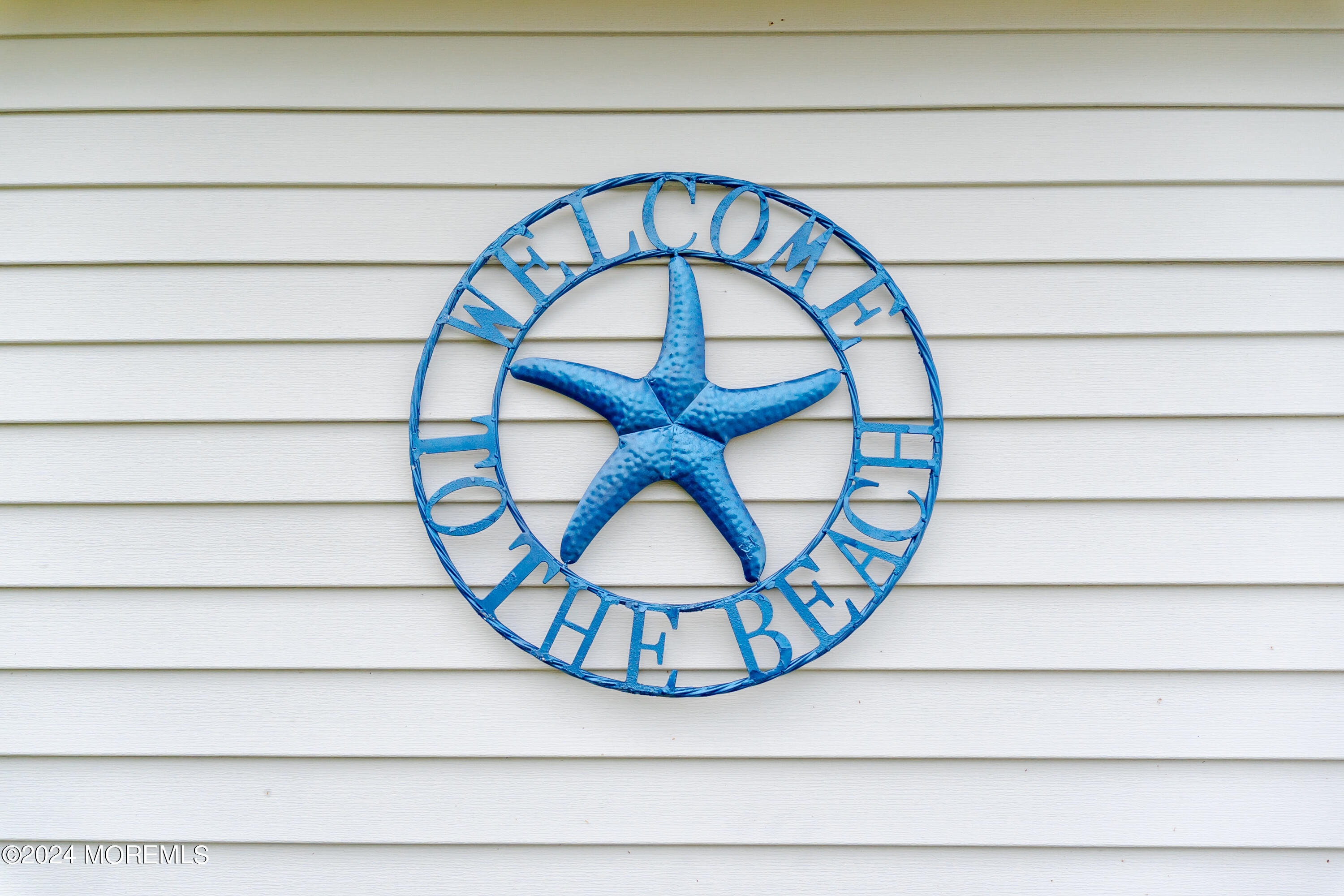18 Valentine Street, Unit REAR Monmouth Beach, NJ 07750 - Photo 13 of 13 a close up of a sign on a window