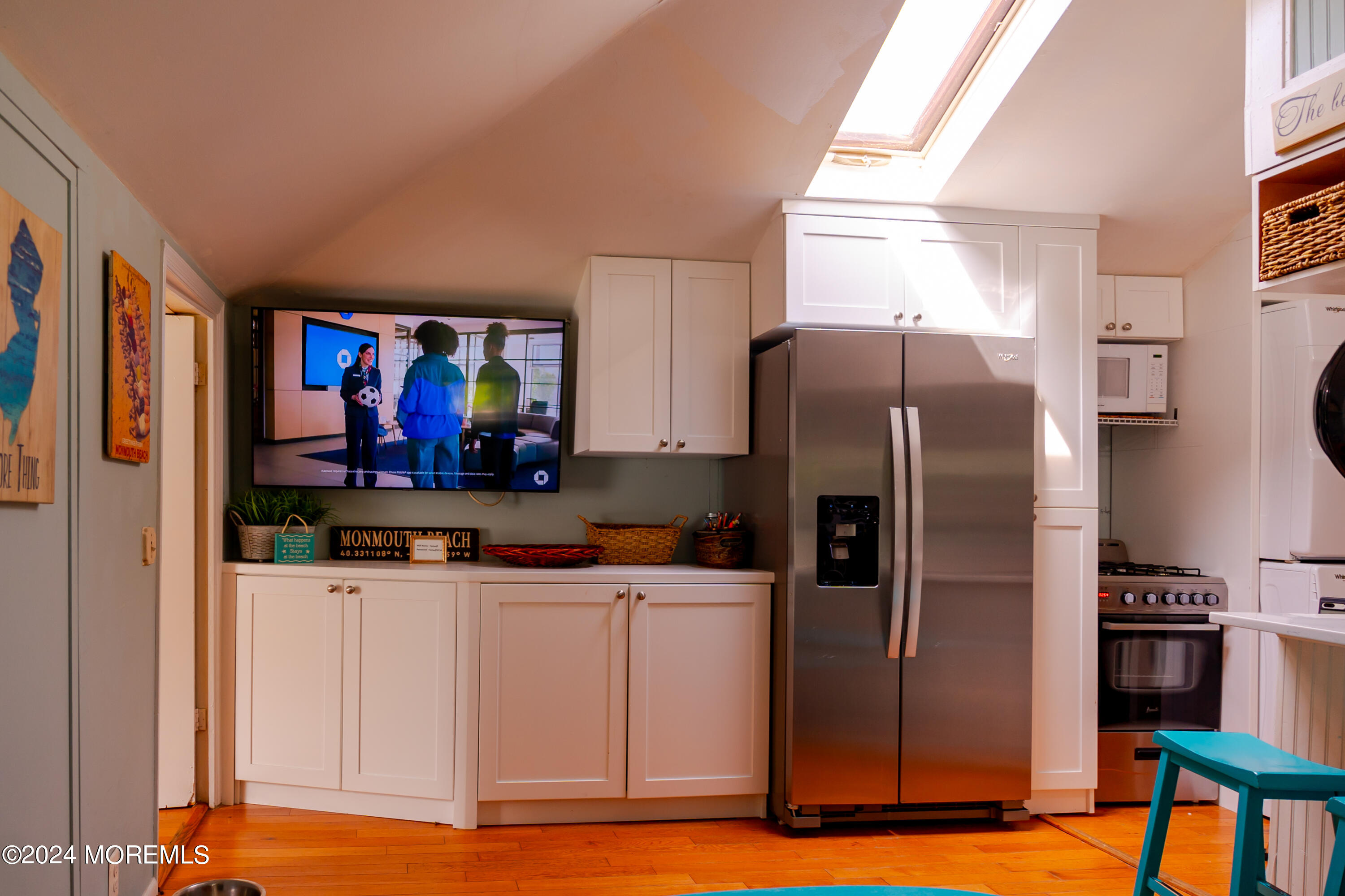 18 Valentine Street, Unit REAR Monmouth Beach, NJ 07750 - Photo 3 of 13 a kitchen with stainless steel appliances a refrigerator sink and microwave
