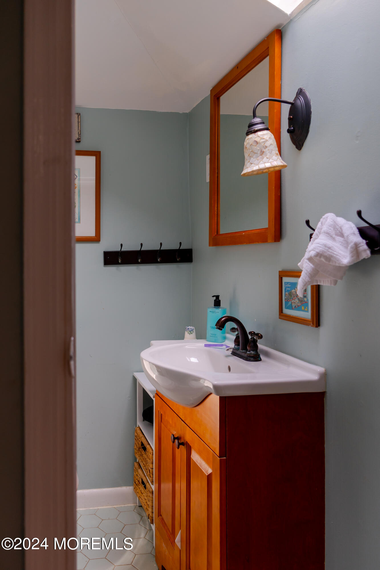 18 Valentine Street, Unit REAR Monmouth Beach, NJ 07750 - Photo 8 of 13 a bathroom with a sink and a mirror
