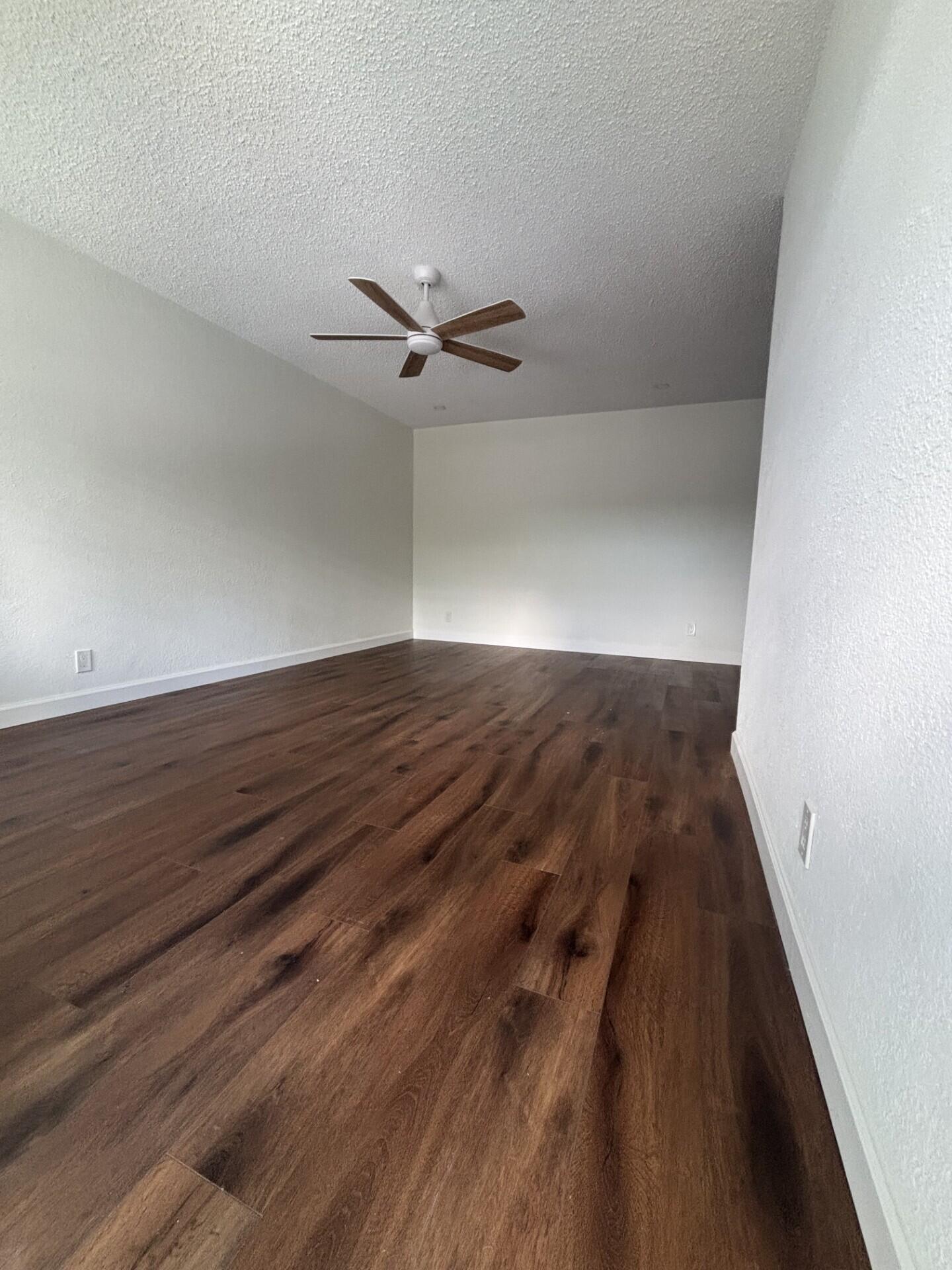 3510 Harrison Street, Unit 12 Hollywood, FL 33021 - Photo 15 of 18 wooden floor in an empty room