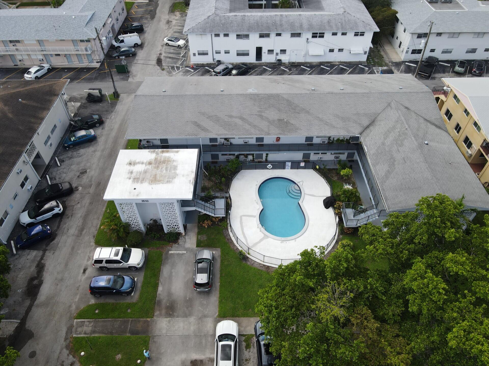 3510 Harrison Street, Unit 12 Hollywood, FL 33021 - Photo 18 of 18 an aerial view of a house with a swimming pool