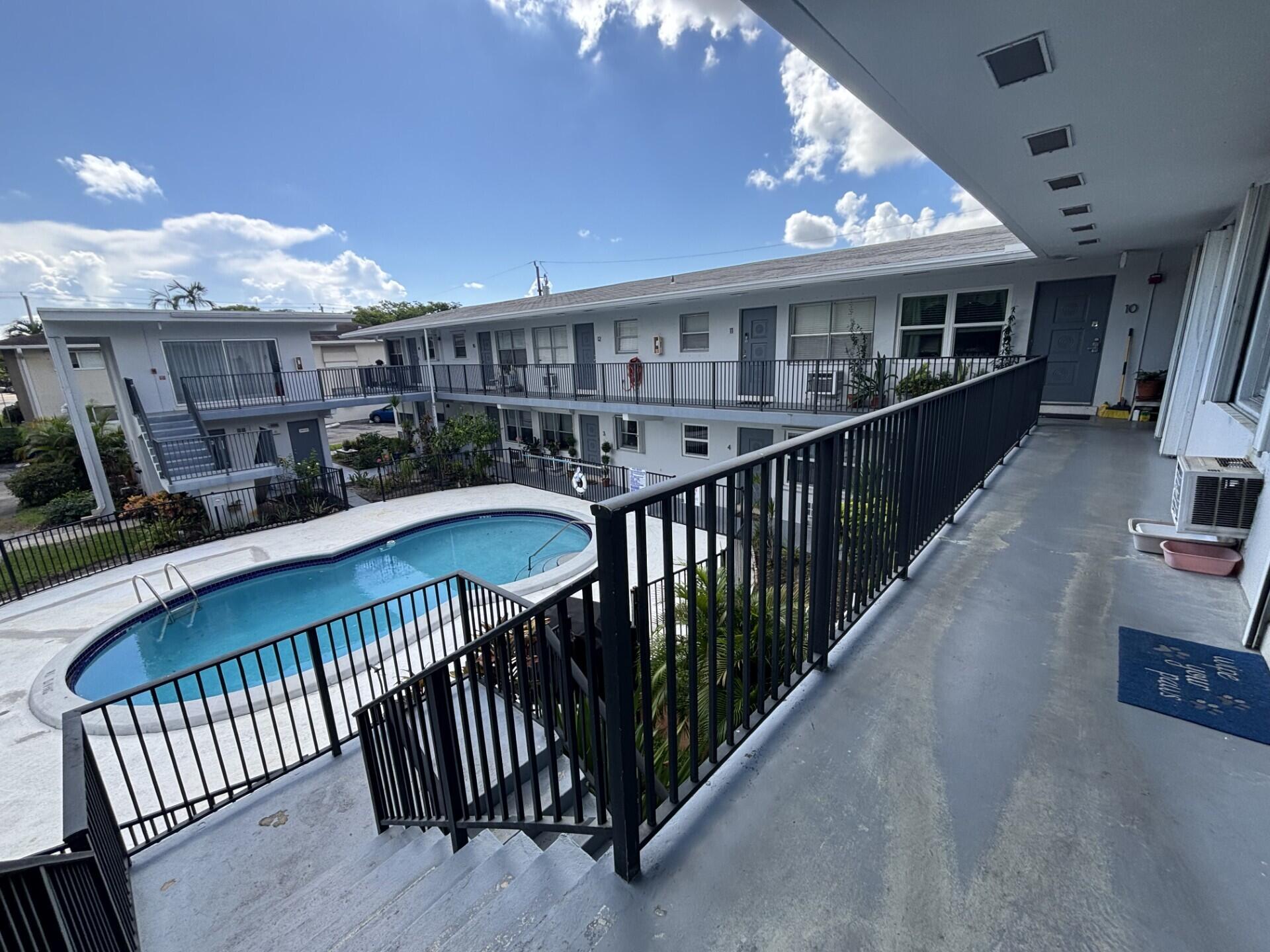 3510 Harrison Street, Unit 12 Hollywood, FL 33021 - Photo 3 of 18 a view of a house with pool and deck