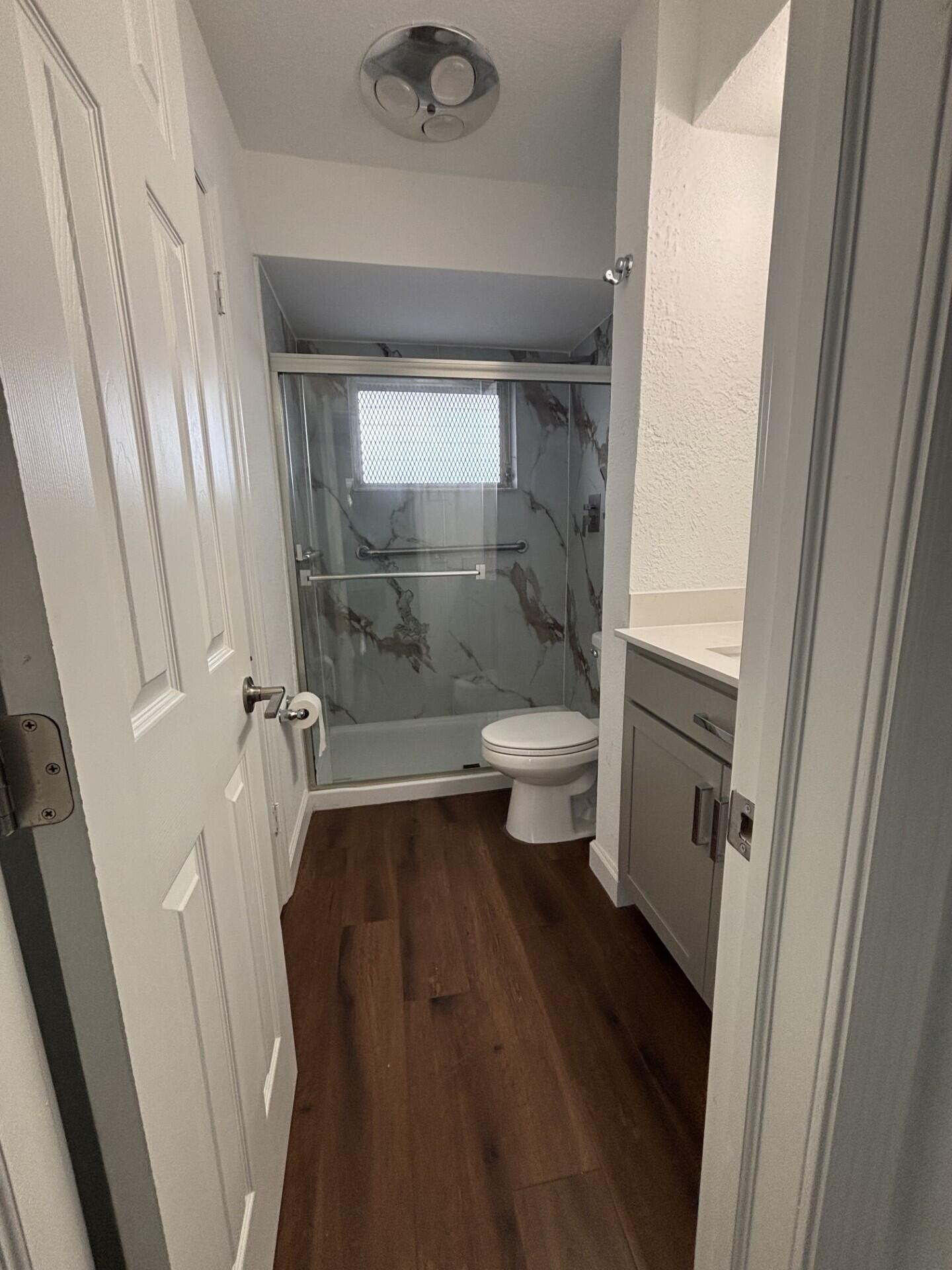 3510 Harrison Street, Unit 12 Hollywood, FL 33021 - Photo 7 of 18 a bathroom with a sink and a shower