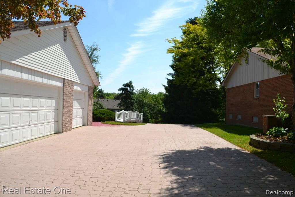 419 Lake Forest Road Rochester, MI 48309 - Photo 88 of 99 3-Cat Attached Garage w/ 2 openers and custom stamped concrete driveway