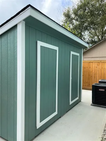 a backyard of a house with barbeque oven