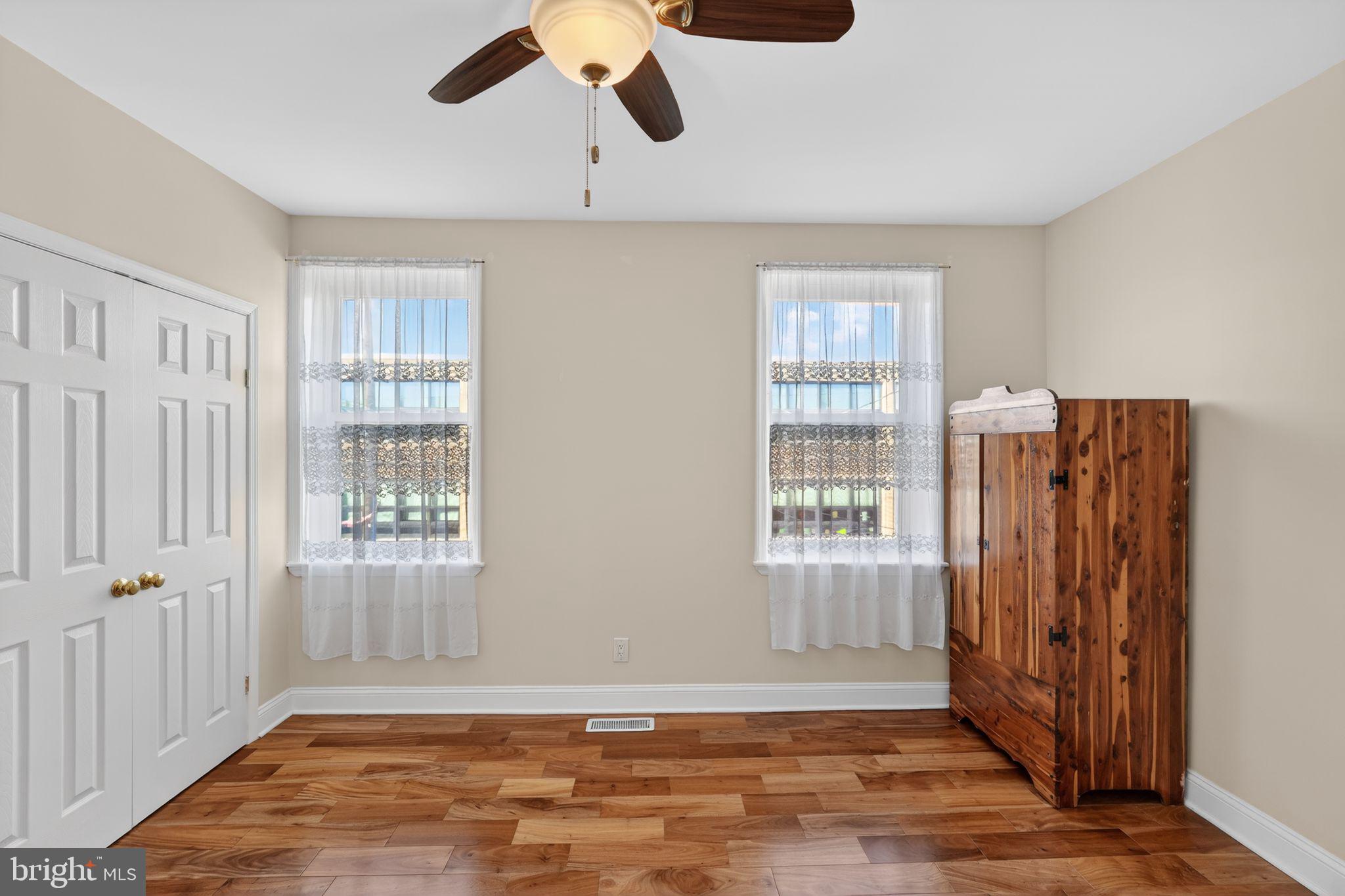 2515 South 16th Street Philadelphia, PA 19145 - Photo 17 of 29 a view of an empty room with wooden floor and a window