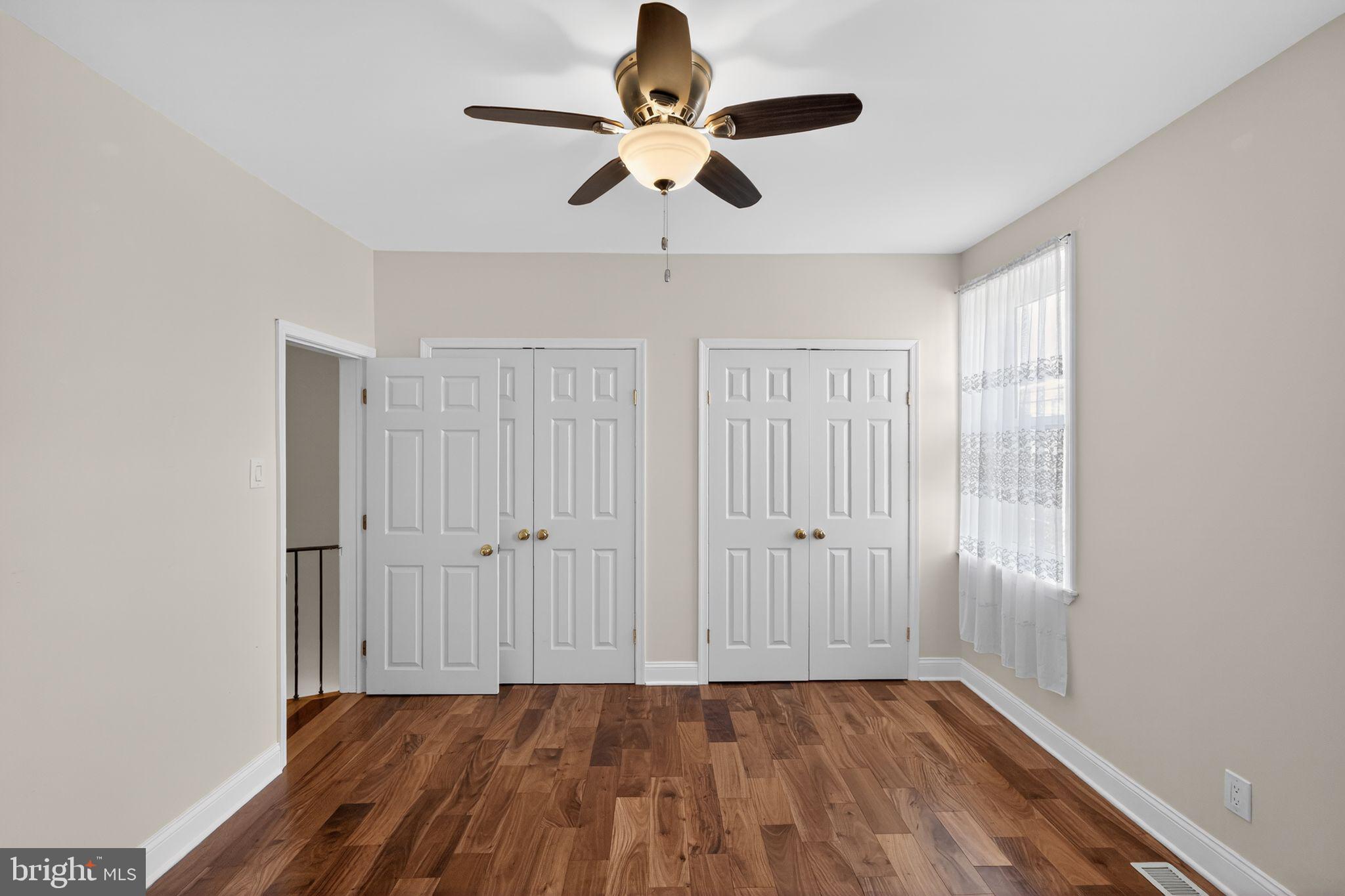 2515 South 16th Street Philadelphia, PA 19145 - Photo 18 of 29 a view of empty room with wooden floor and fan