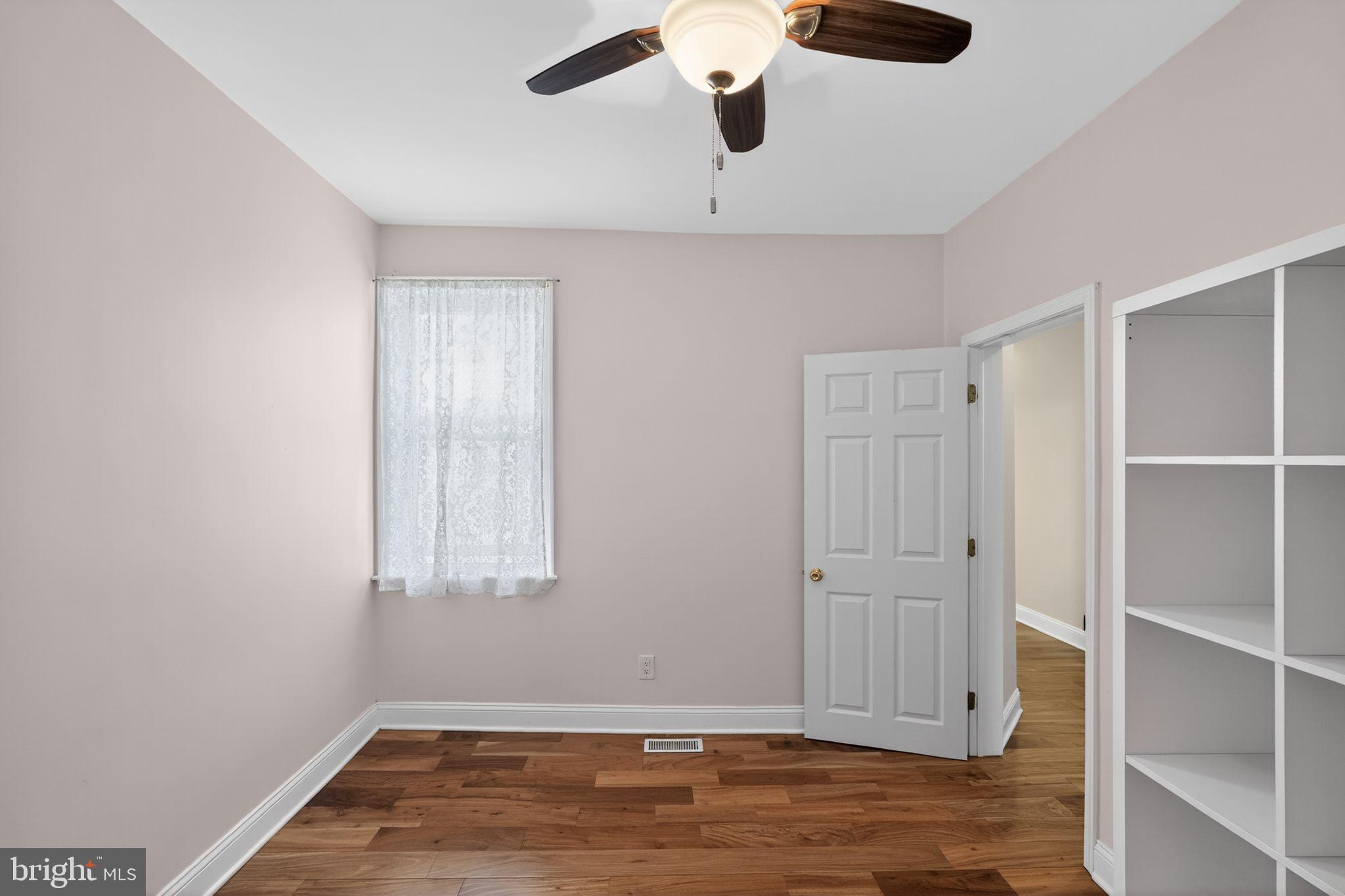 2515 South 16th Street Philadelphia, PA 19145 - Photo 22 of 29 an empty room with wooden floor and windows