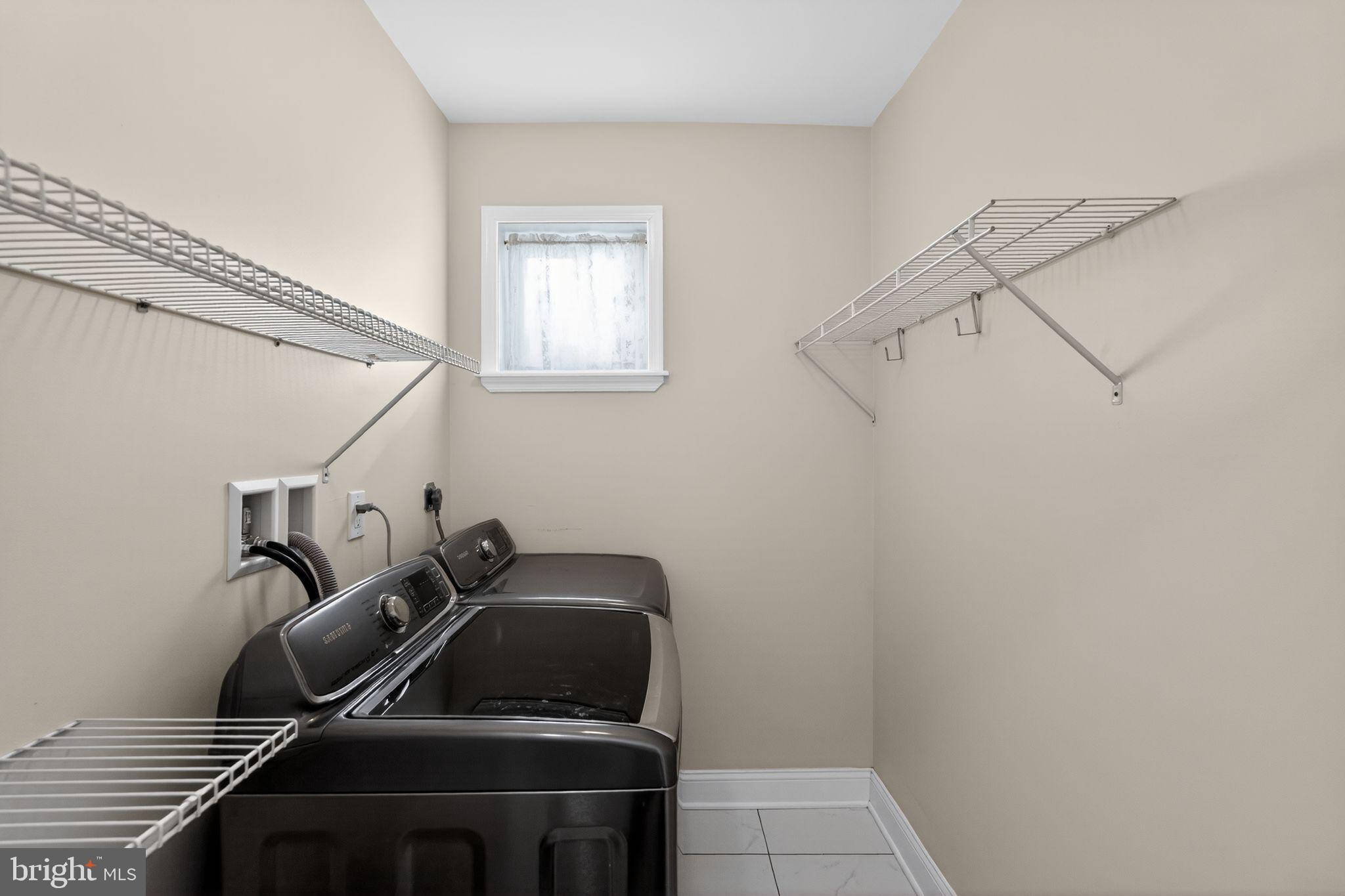 2515 South 16th Street Philadelphia, PA 19145 - Photo 24 of 29 a view of storage and utility room with racks on the wall