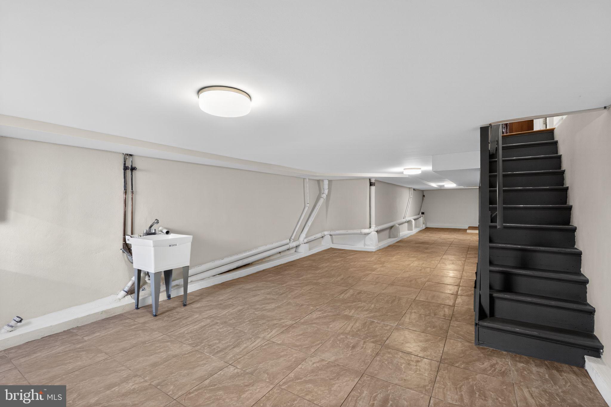 2515 South 16th Street Philadelphia, PA 19145 - Photo 27 of 29 a view of a room with gym equipment and a chandelier