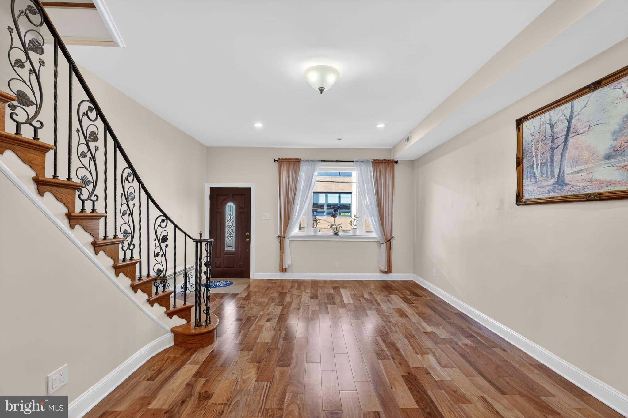 2515 South 16th Street Philadelphia, PA 19145 - Photo 4 of 29 a view of empty room with wooden floor and fan