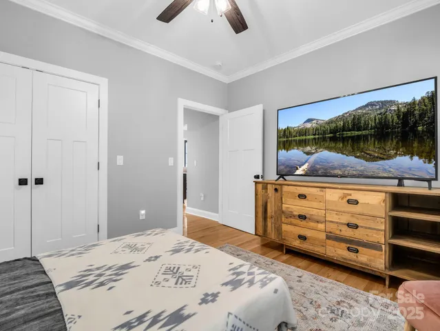 a bedroom with a bed and a dresser