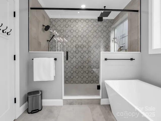 a bathroom with a bathtub and a shower