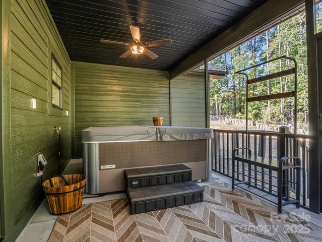 a view of balcony with wooden floor