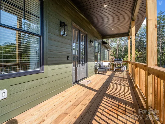 a view of balcony with wooden floor