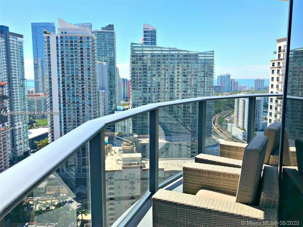 a view of balcony with furniture