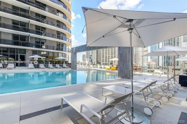 a patio view with a table and chairs