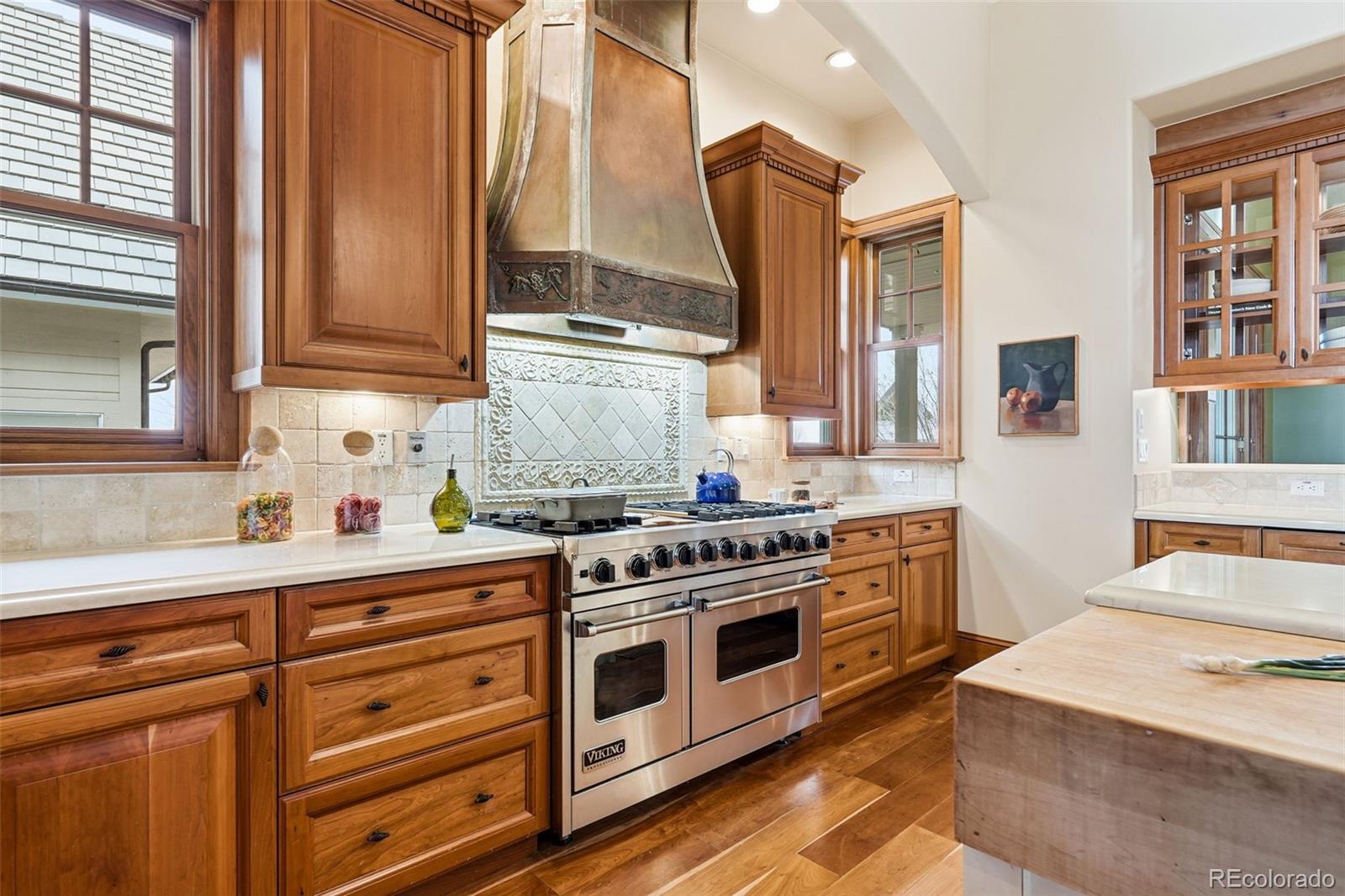 5101 St Vrain Road Longmont, CO 80503 - Photo 9 of 49 a kitchen with stainless steel appliances a stove a sink and cabinets