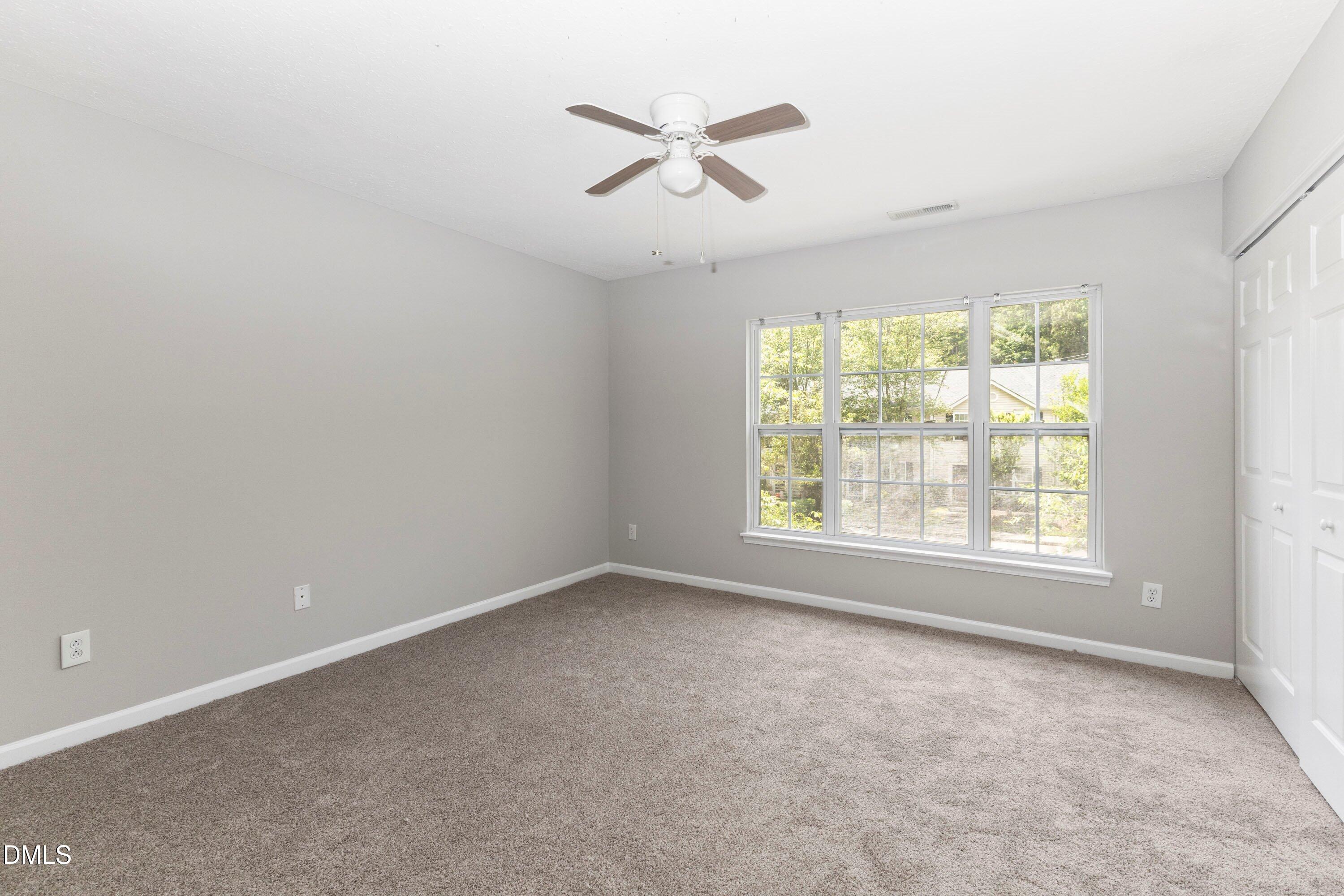 3358 Tarleton West Durham, NC 27713 - Photo 18 of 23 an empty room with a window and a ceiling fan