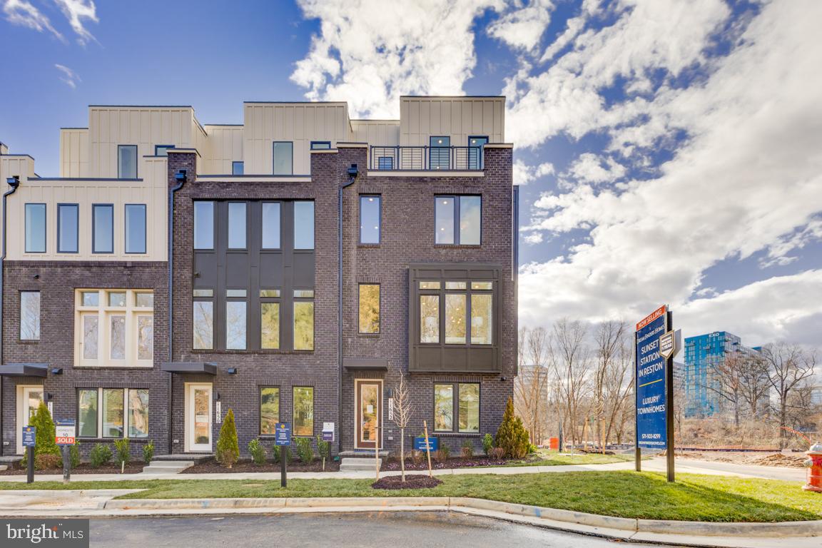 a city street lined with buildings and trees
