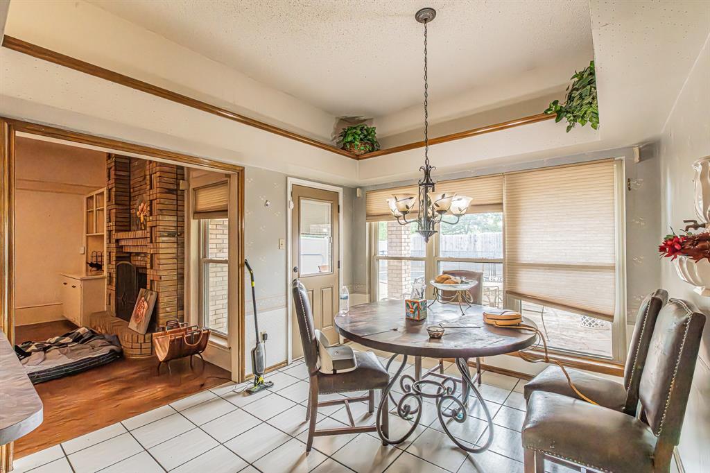 3309 Timber View Circle Bedford, TX 76021 - Photo 9 of 38 a view of a dining room with furniture window and outside view