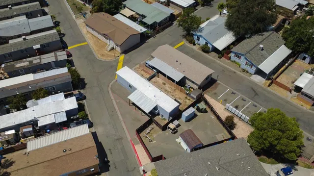 an aerial view of a house with parking space