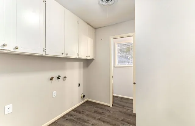 a view of an empty room with closet