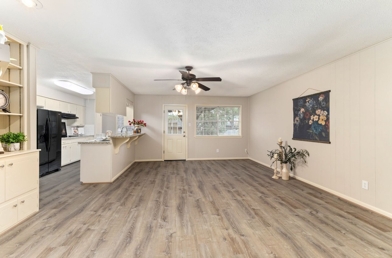 1609 Longhofer Street Brenham, TX 77833 - Photo 3 of 18 a view of livingroom with furniture wooden floor and a window