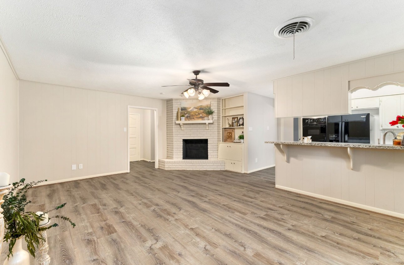 1609 Longhofer Street Brenham, TX 77833 - Photo 4 of 18 a view of a kitchen with microwave and cabinets