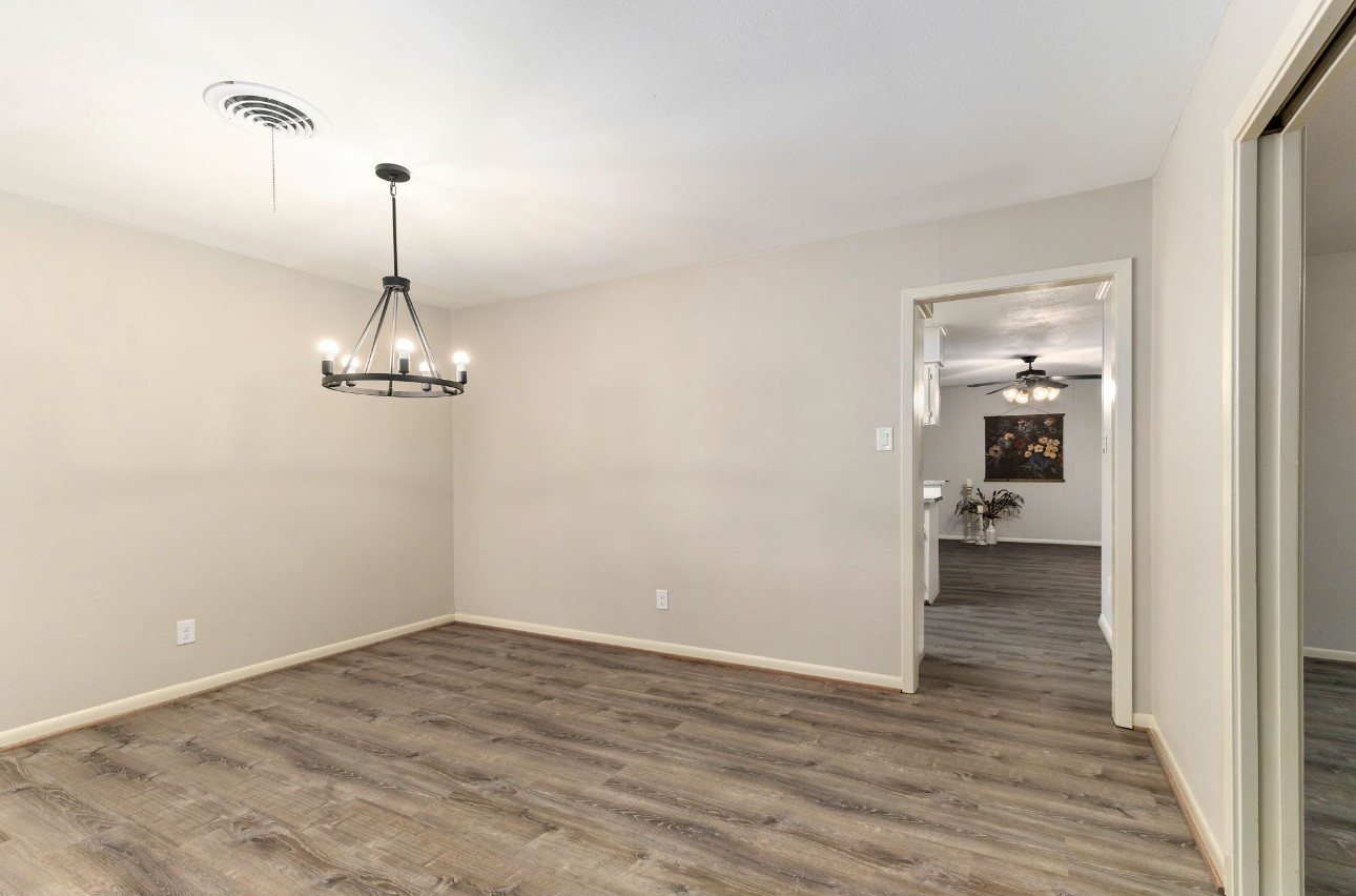 1609 Longhofer Street Brenham, TX 77833 - Photo 5 of 18 a view of empty room with wooden floor