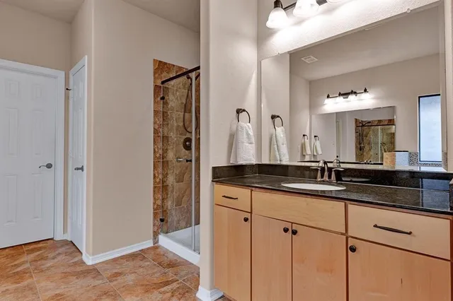 a bathroom with double sink and a mirror