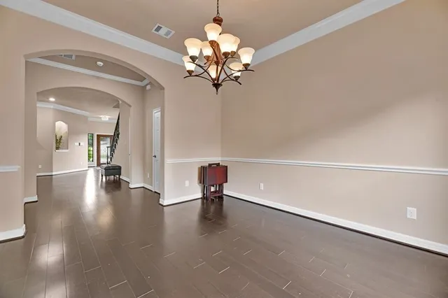 a view of a hallway with a chandelier
