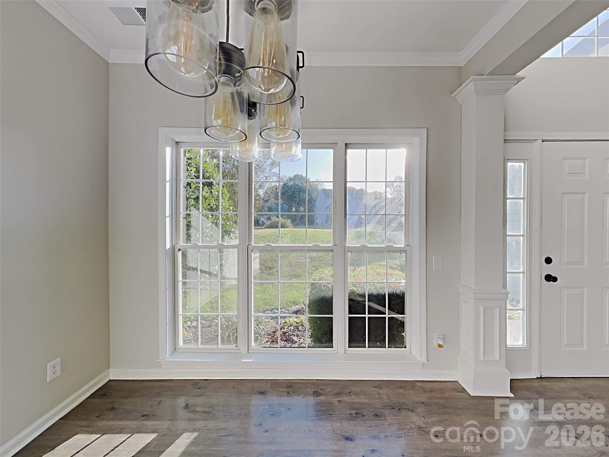 1015 Clearbrook Road Matthews, NC 28105 - Photo 11 of 25 a view of a room with wooden floor and workspace