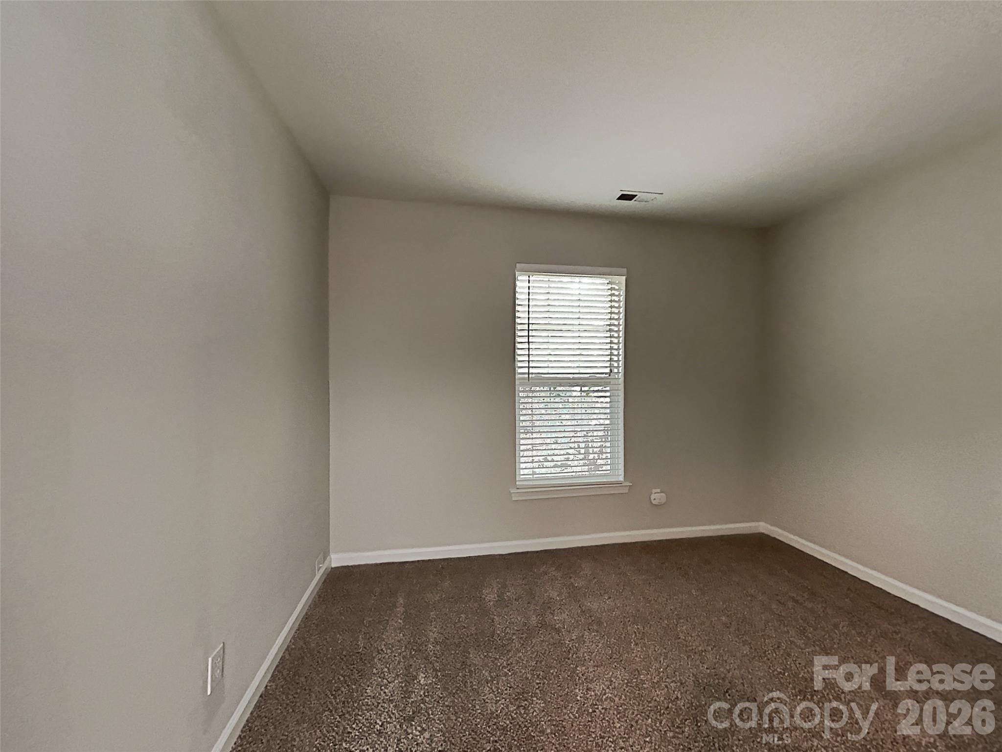 1015 Clearbrook Road Matthews, NC 28105 - Photo 18 of 25 an empty room with a window