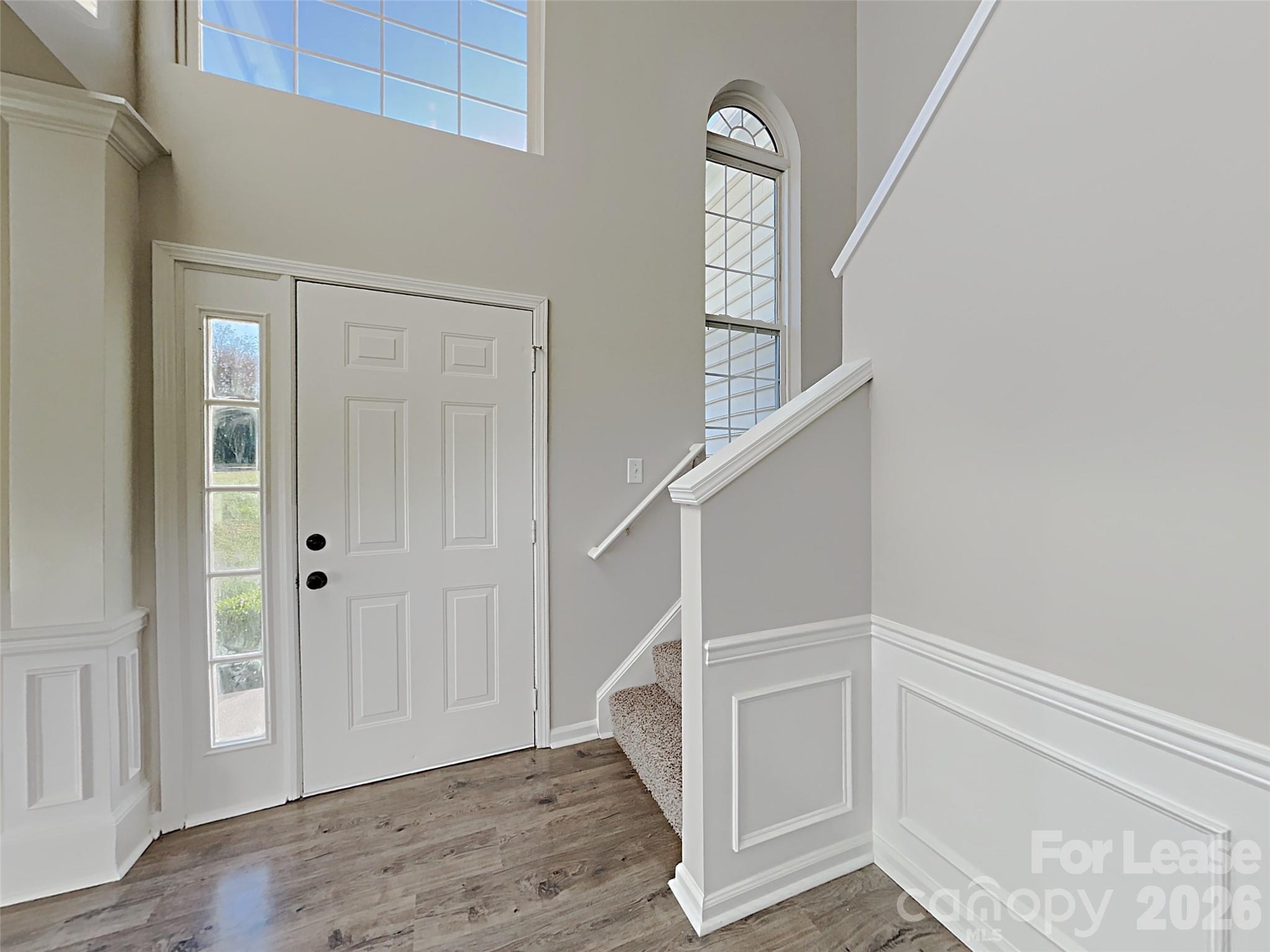 1015 Clearbrook Road Matthews, NC 28105 - Photo 2 of 25 an entryway with a hardwood floor