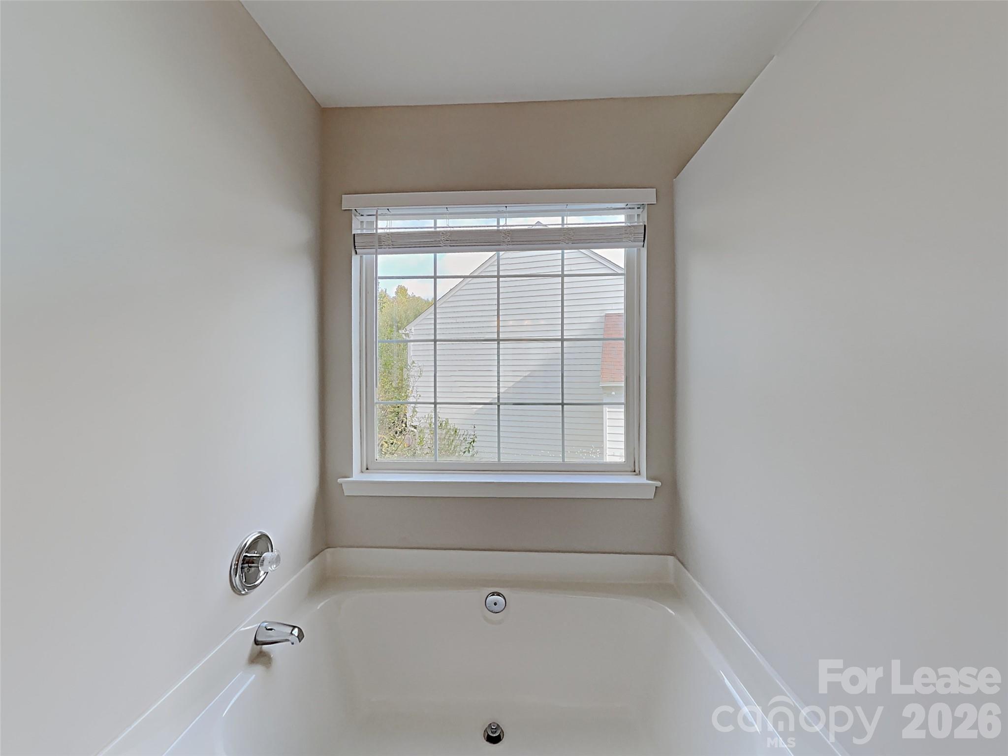 1015 Clearbrook Road Matthews, NC 28105 - Photo 21 of 25 a bathroom with a bathtub