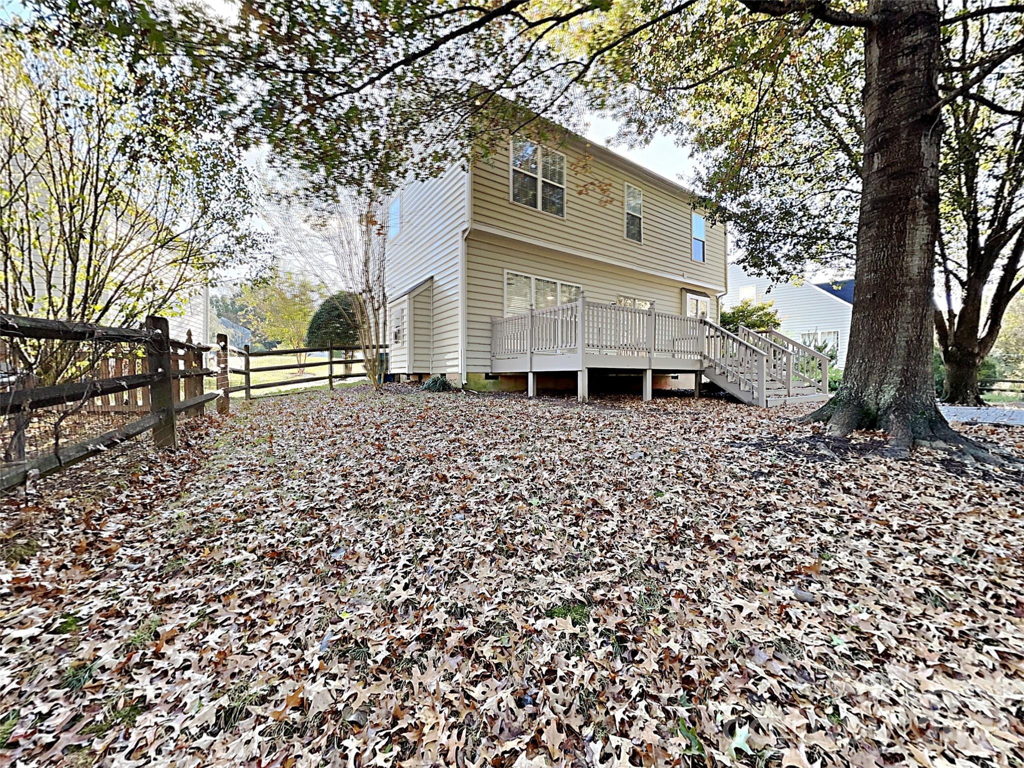 1015 Clearbrook Road Matthews, NC 28105 - Photo 25 of 25 a backyard of a house with lots of green space