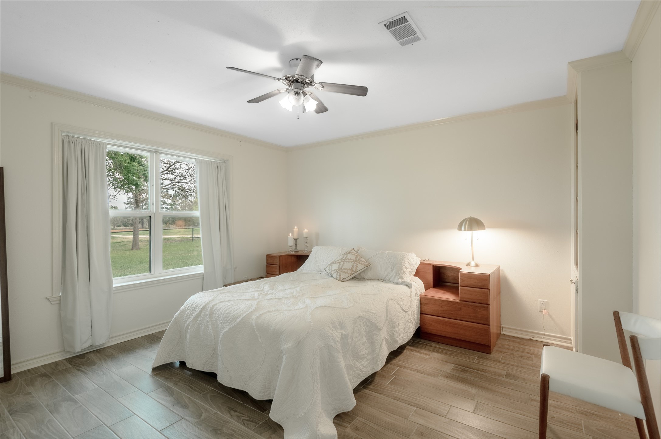 758 Wire Road Huntsville, TX 77320 - Photo 44 of 44 a bedroom with a large bed and a window
