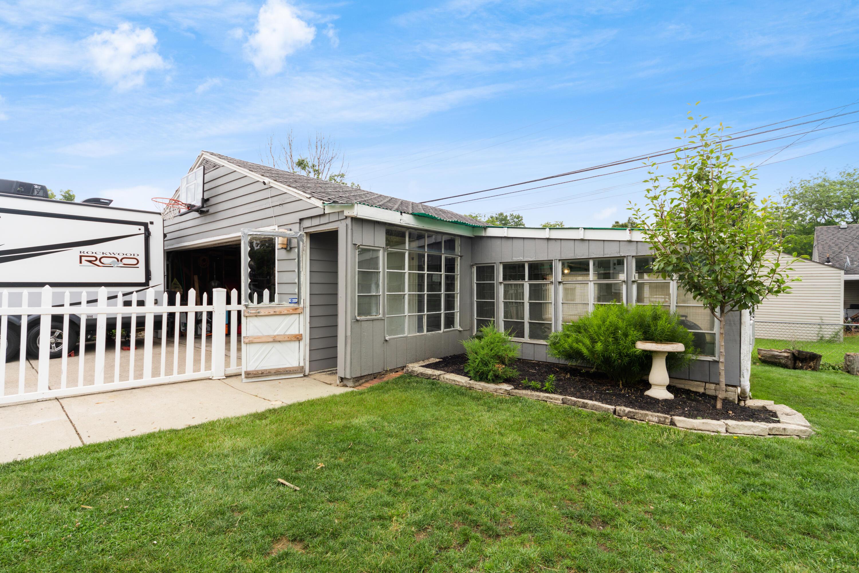 412 Deerfield Road Columbus, OH 43228 - Photo 2 of 33 OVERSIZED 2 CARE GARAGE WITH ELECTRIC. ATTACHED 3 SEASON ROOM