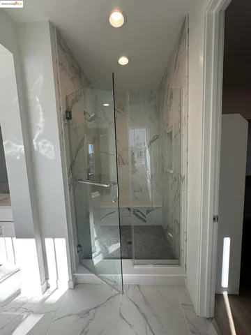 a bathroom with a shower and toilet