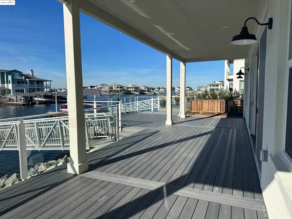 a view of a balcony with wooden floor