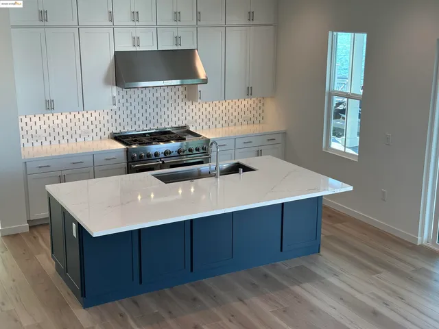 a kitchen with a cabinets and stove