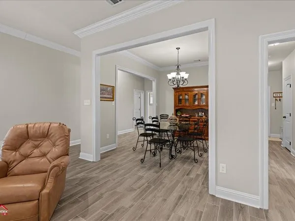 a view of a livingroom with furniture and wooden floor